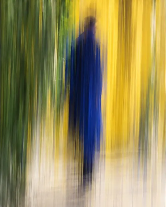 Near-abstract ultramarine, yellow and green vertical bands with a faint ghost of a man's silhouette